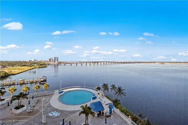 a view of a lake and outdoor seating