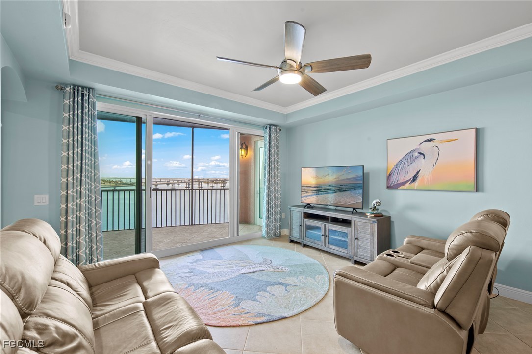 2745 First Street, Unit 801 Fort Myers, FL 33916 - Photo 18 of 50 a living room with furniture and a flat screen tv