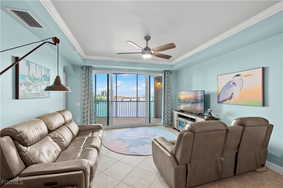2745 First Street, Unit 801 Fort Myers, FL 33916 - Photo 19 of 50 a living room with furniture a ceiling fan and a window