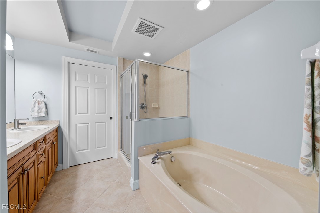 2745 First Street, Unit 801 Fort Myers, FL 33916 - Photo 24 of 50 a bathroom with a tub sink and mirror
