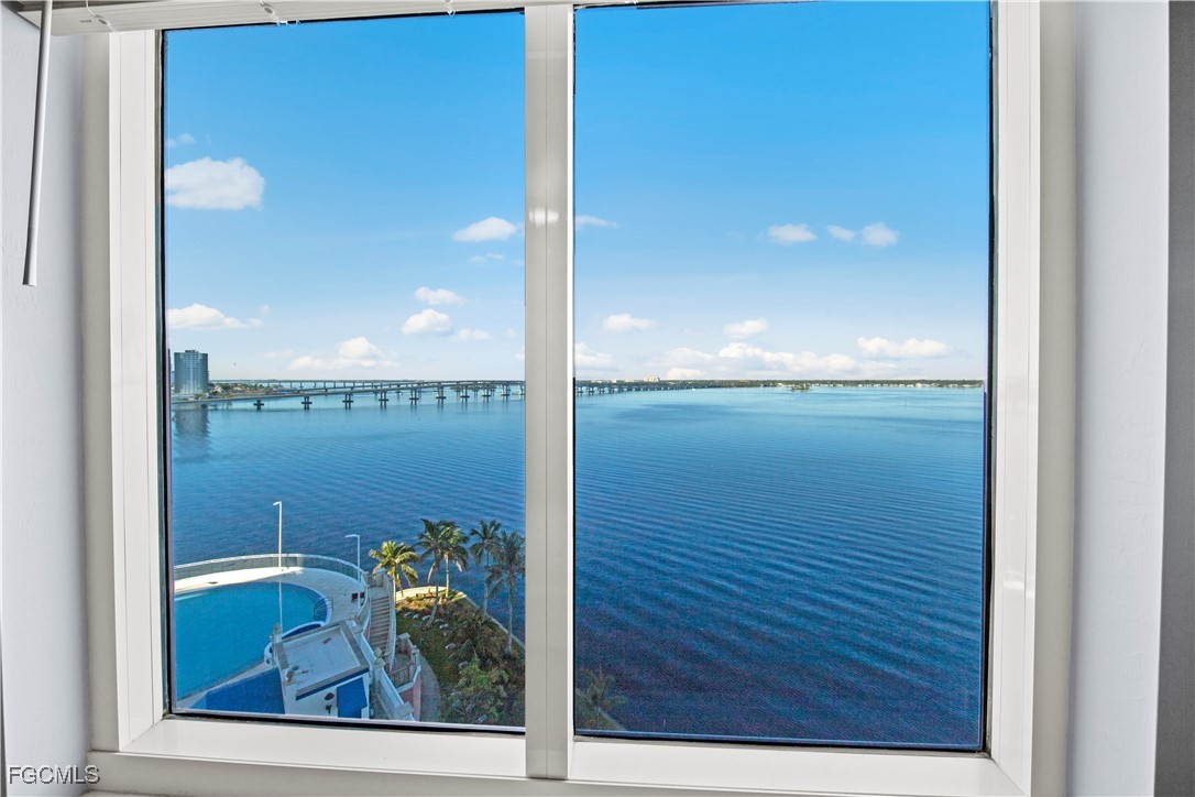 2745 First Street, Unit 801 Fort Myers, FL 33916 - Photo 30 of 50 a view of a lake from a hallway