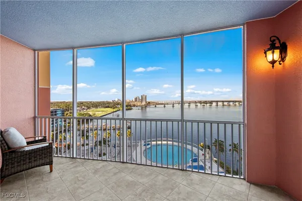a view of a balcony with furniture