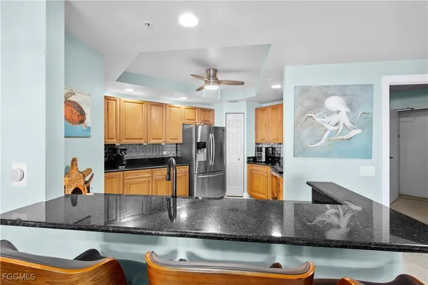 a view of a living room and kitchen