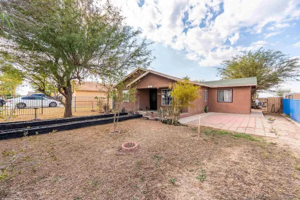 a house with trees in the background