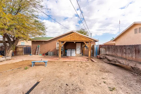 a view of a house with a yard covered in snow