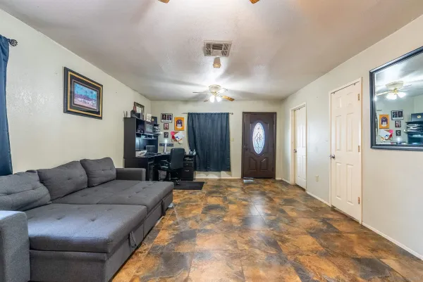 a living room with furniture and window