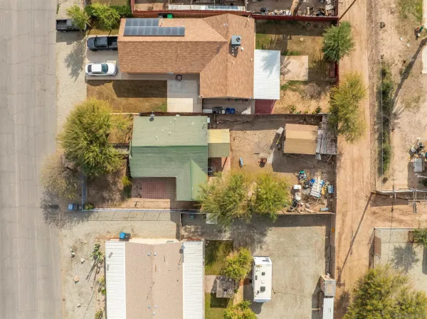 an aerial view of residential houses with outdoor space