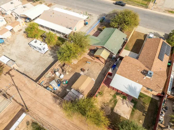 an aerial view of a house with a swimming pool