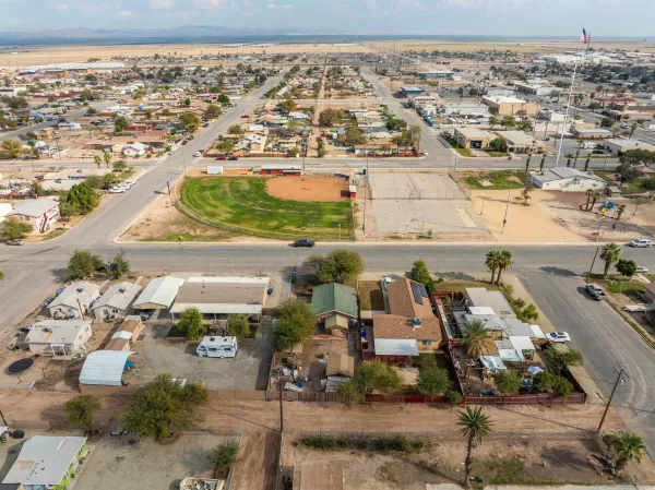 an aerial view of residential houses with outdoor space