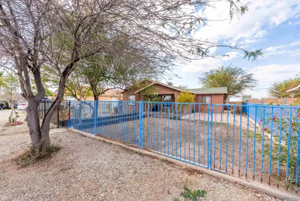 a view of house with outdoor space and swimming pool
