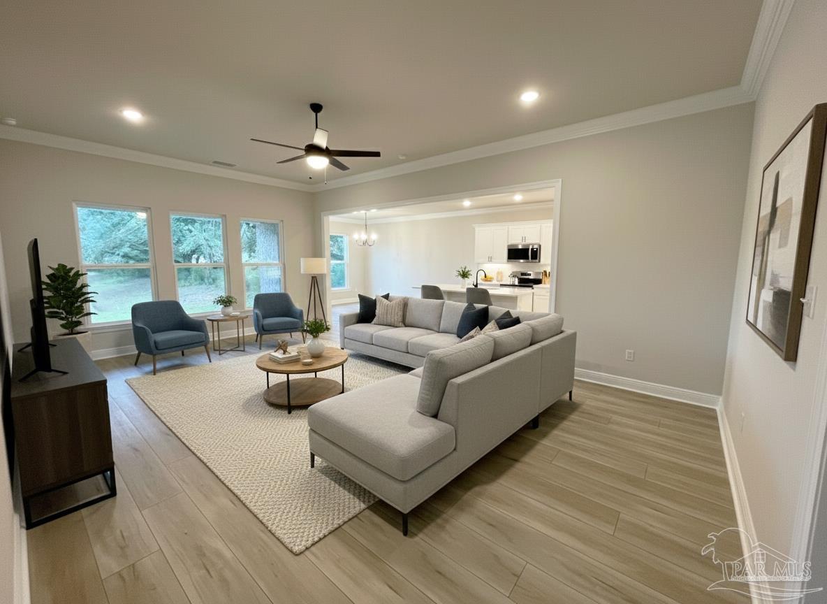 7950 Klondike Road, Unit 25 Pensacola, FL 32526 - Photo 2 of 6 a living room with furniture and a chandelier