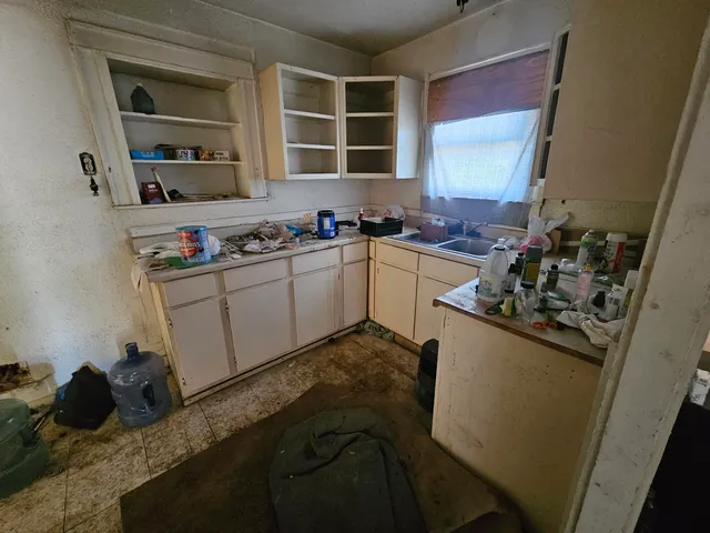 a view of a storage & utility room with two washing machine