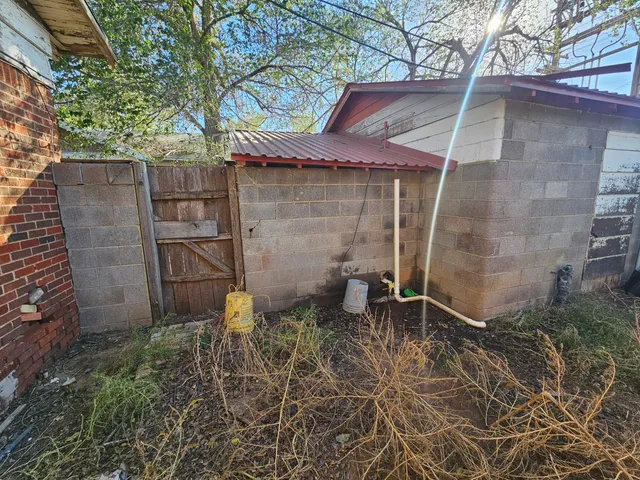 a backyard of a house with seating space