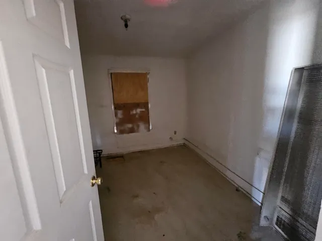 an empty room with a bench