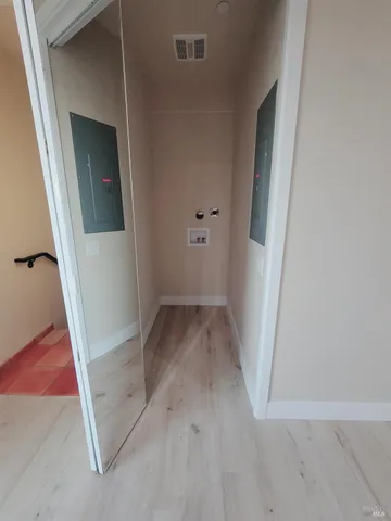 an empty room with a mirror