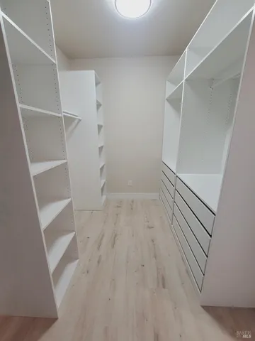 a view of an empty walk in closet