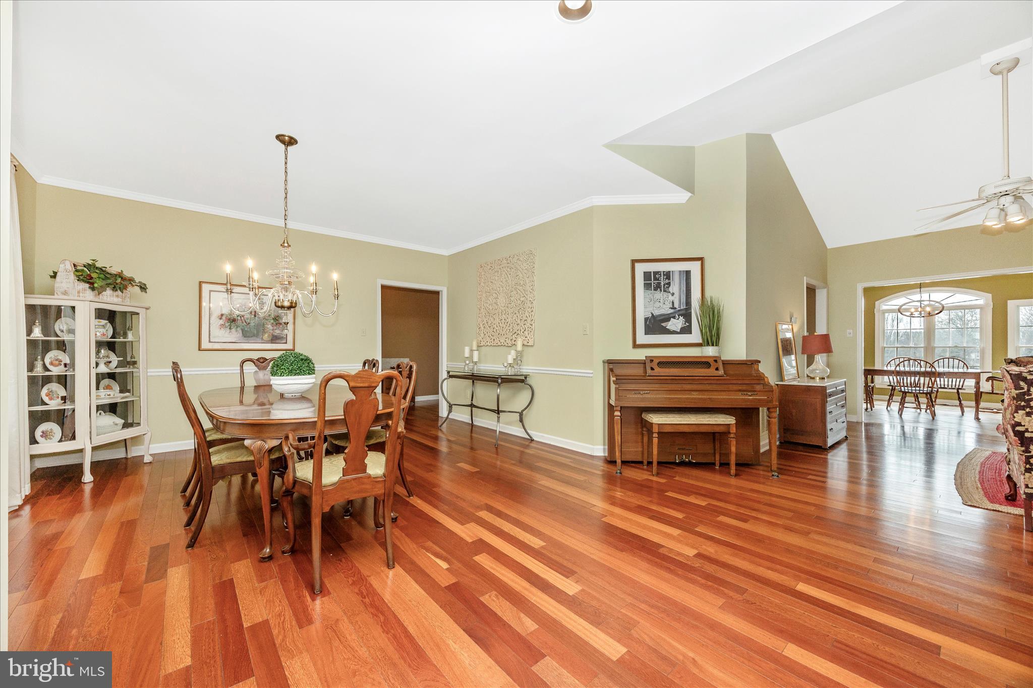 6181 Challedon Circle Mount Airy, MD 21771 - Photo 11 of 63 a living room with furniture a dining table and a wooden floor