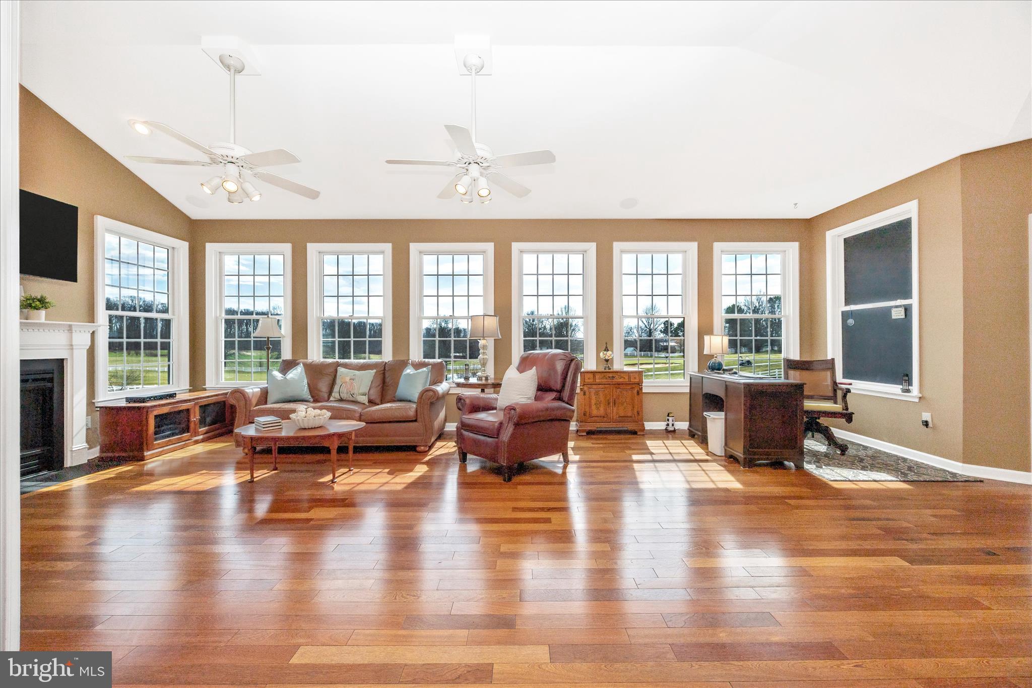 6181 Challedon Circle Mount Airy, MD 21771 - Photo 18 of 63 a living room with furniture large windows and wooden floor