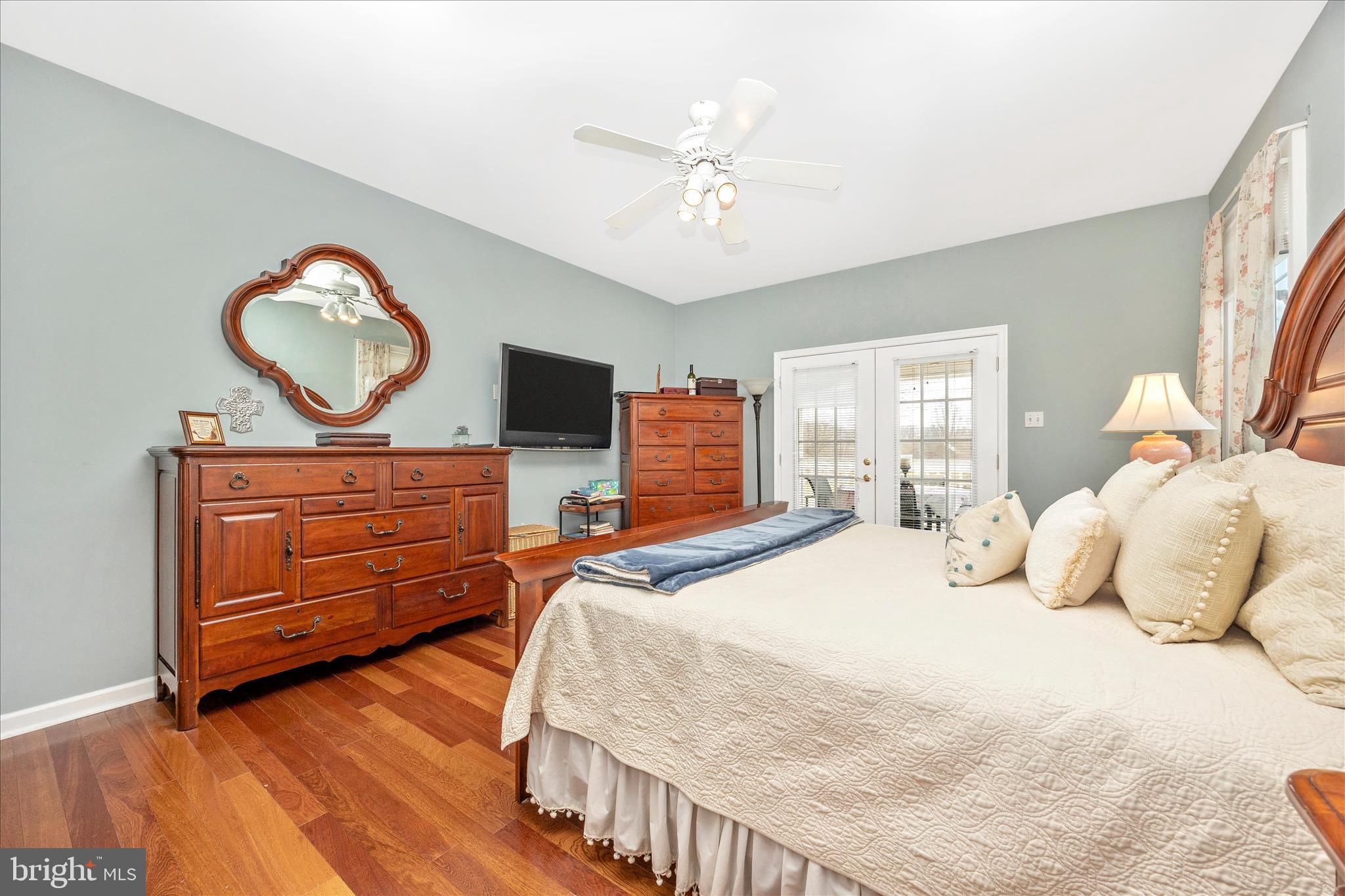 6181 Challedon Circle Mount Airy, MD 21771 - Photo 23 of 63 a bedroom with a bed and a chandelier
