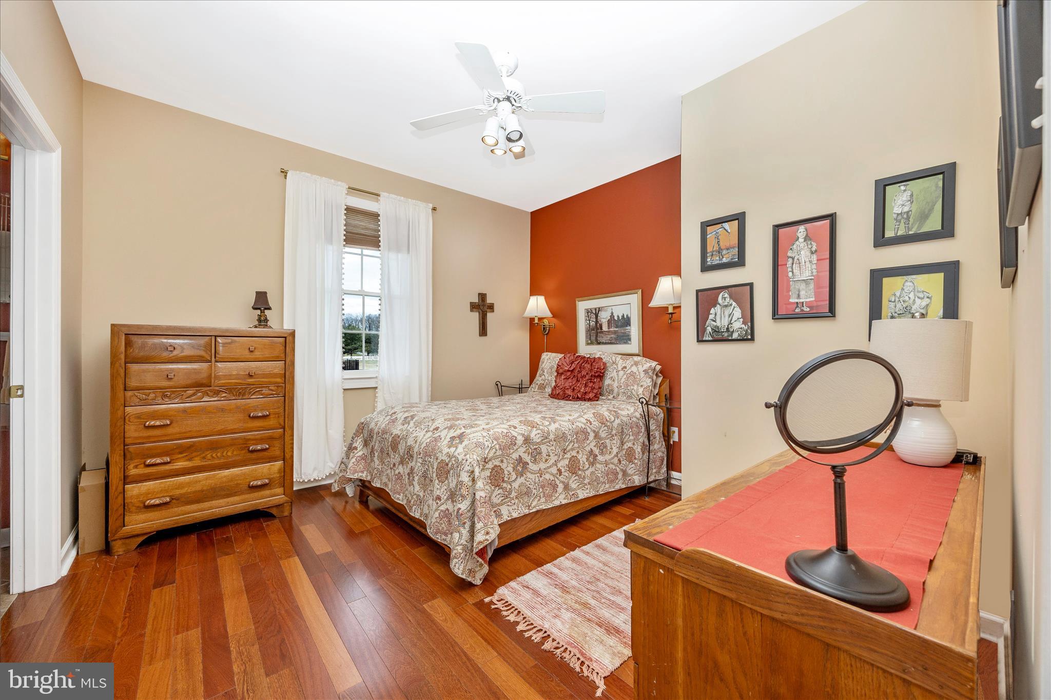 6181 Challedon Circle Mount Airy, MD 21771 - Photo 27 of 63 a bedroom with a bed and wooden floor
