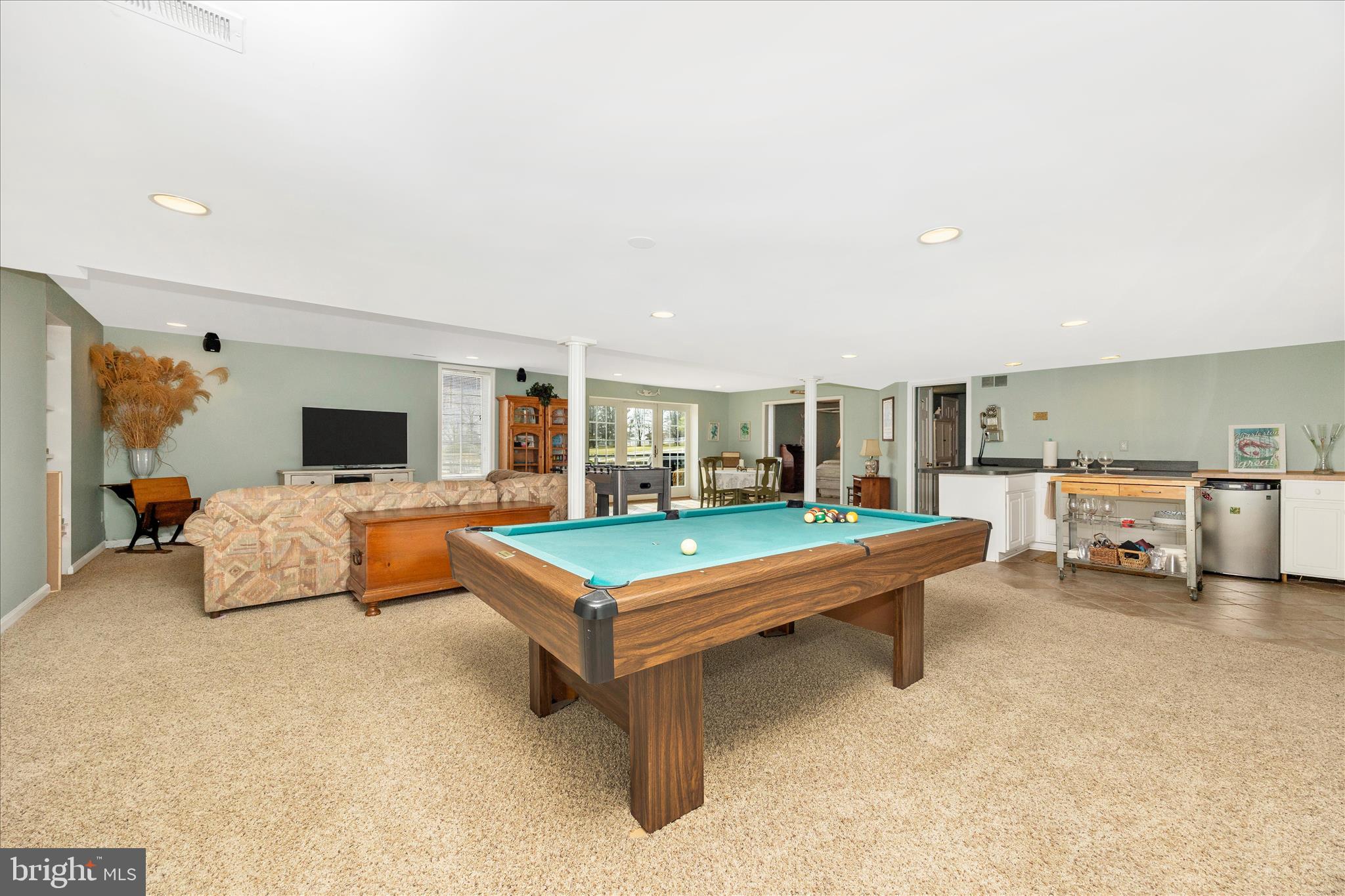 6181 Challedon Circle Mount Airy, MD 21771 - Photo 33 of 63 a living room with furniture pool and a flat screen tv