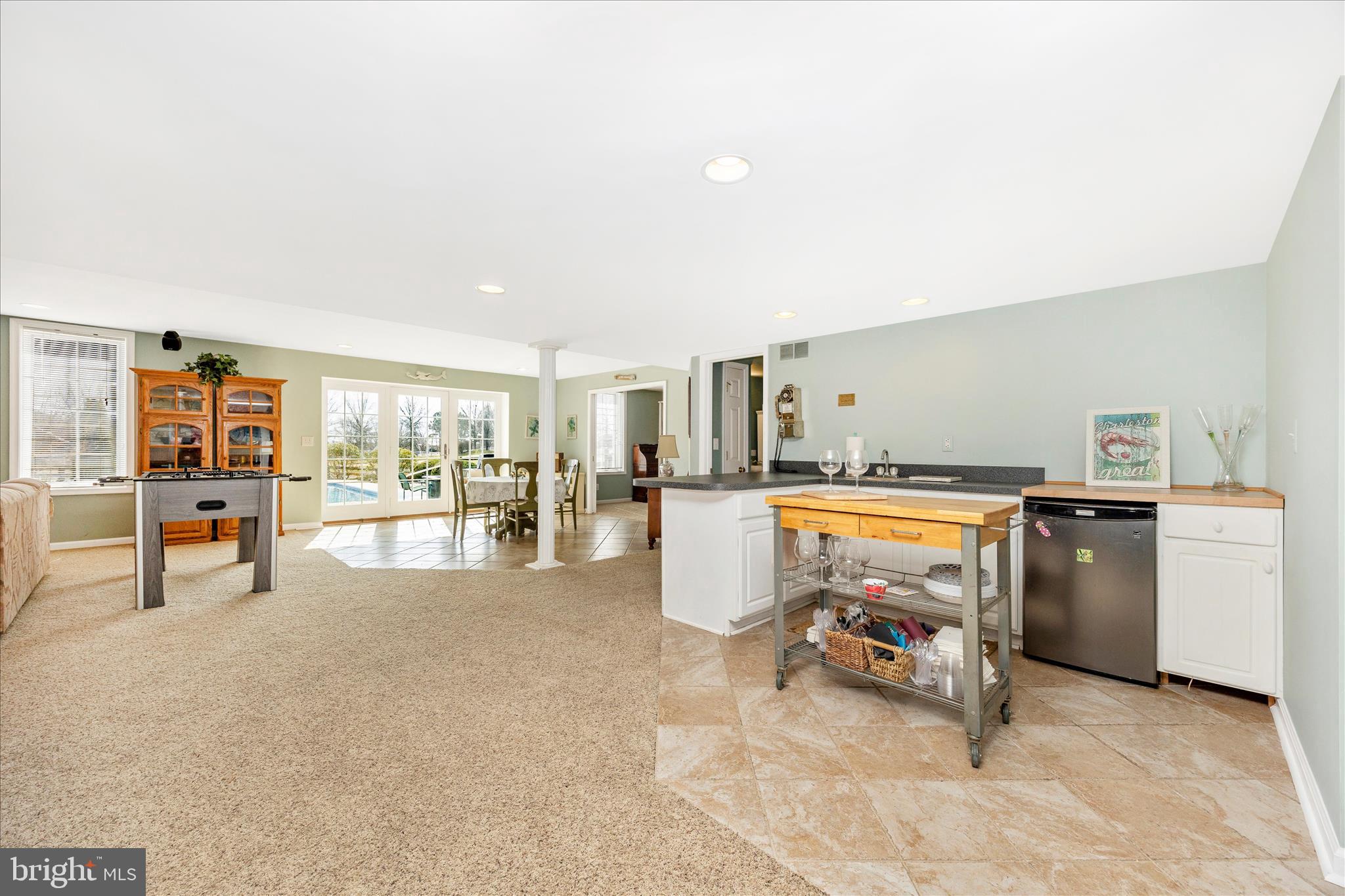 6181 Challedon Circle Mount Airy, MD 21771 - Photo 35 of 63 a view of a living room and a dining table under a large window