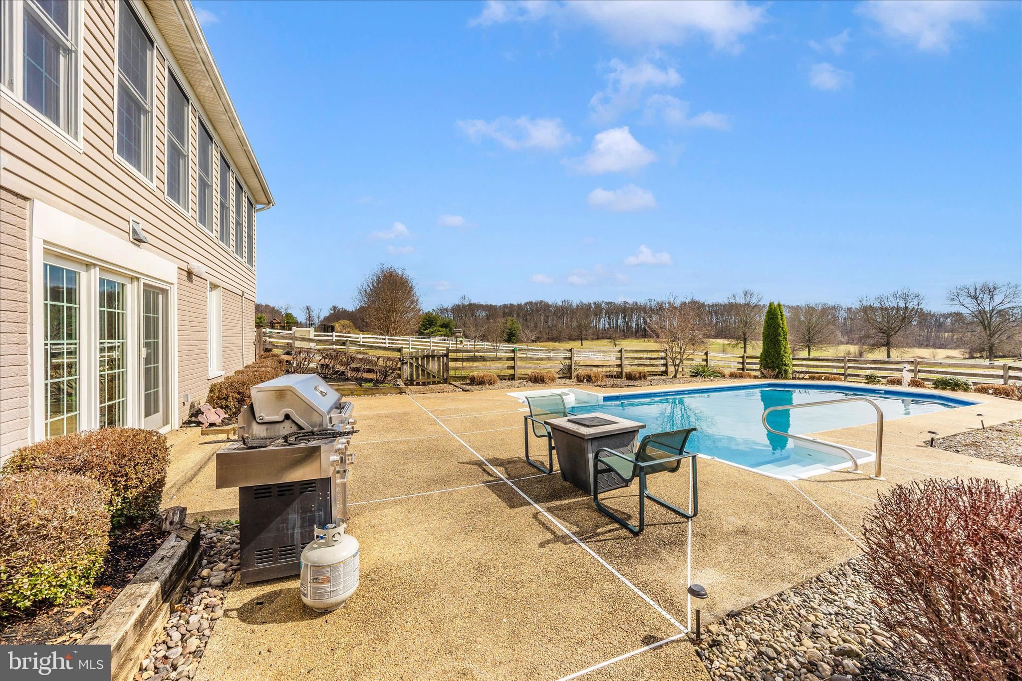 6181 Challedon Circle Mount Airy, MD 21771 - Photo 43 of 63 a view of a swimming pool with outdoor seating and city view
