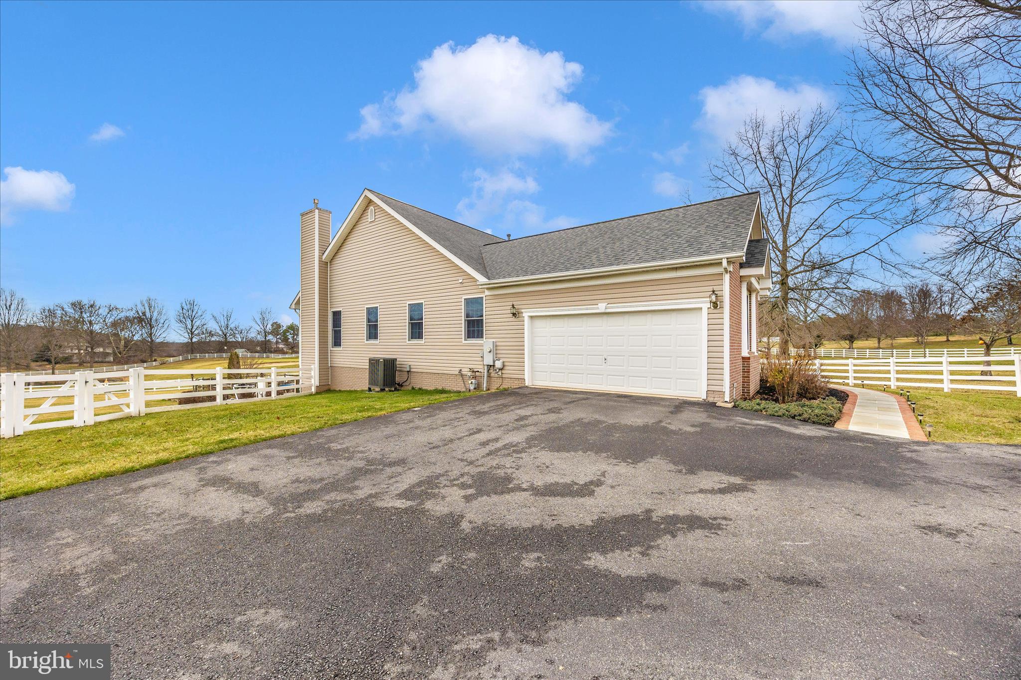 6181 Challedon Circle Mount Airy, MD 21771 - Photo 50 of 63 a view of a house with a yard and garage
