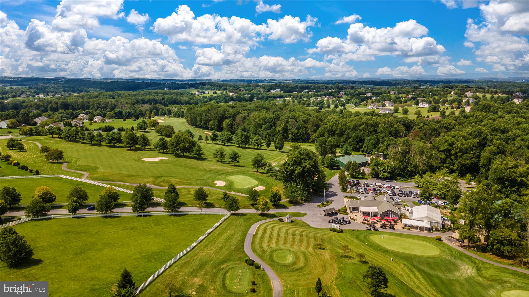 6181 Challedon Circle Mount Airy, MD 21771 - Photo 52 of 63 a view of a golf course with a lake