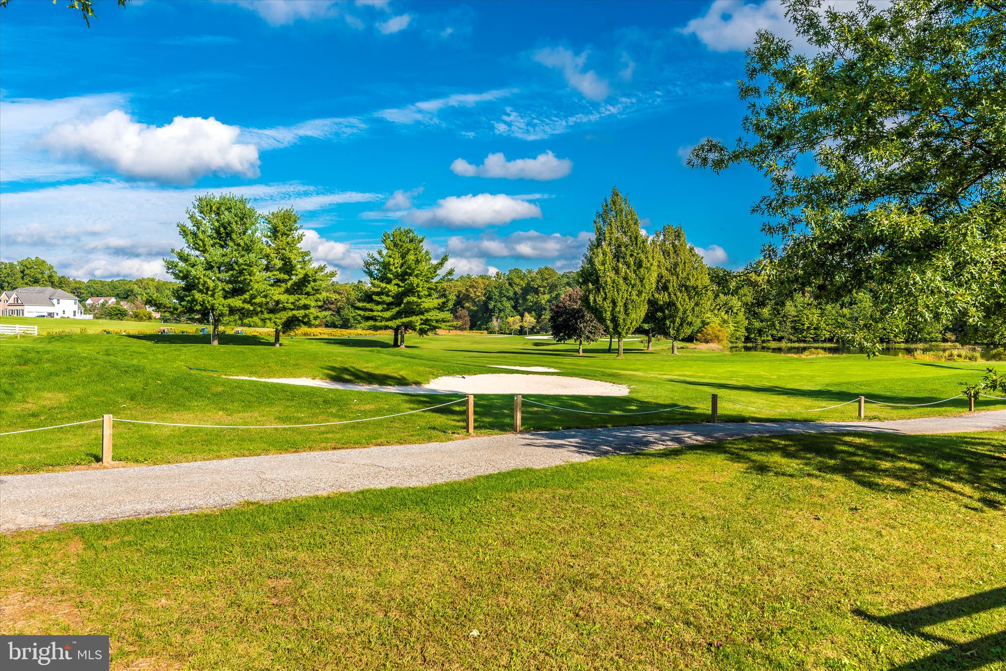 6181 Challedon Circle Mount Airy, MD 21771 - Photo 60 of 63 a view of a golf course with a lake