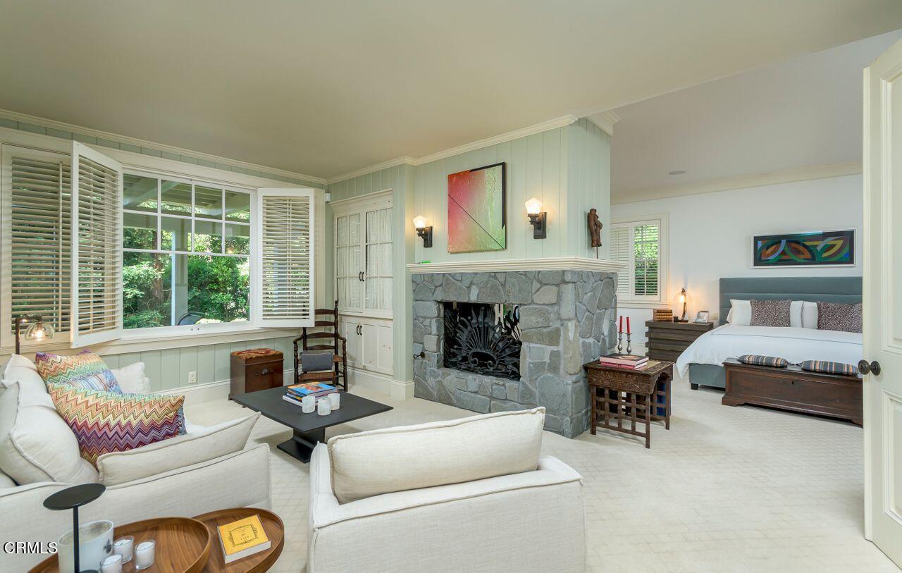 520 Georgian Road La Canada Flintridge, CA 91011 - Photo 27 of 75 a living room with furniture and a fireplace