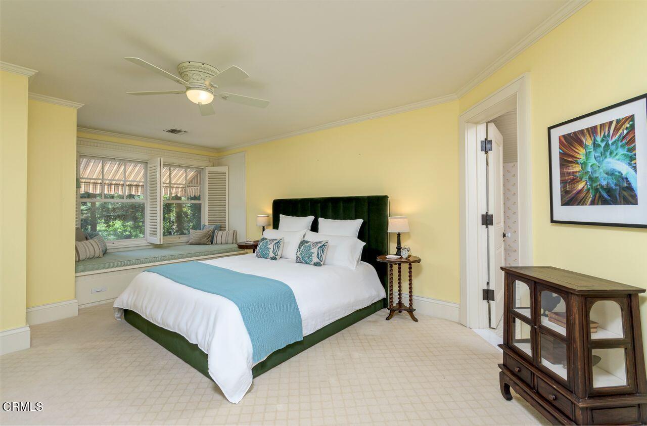 520 Georgian Road La Canada Flintridge, CA 91011 - Photo 33 of 75 a bedroom with a bed painting on wall and a large window