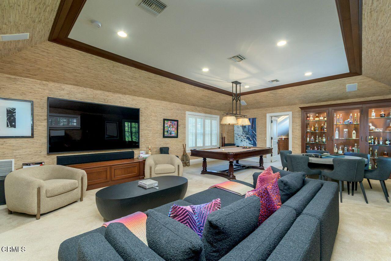 520 Georgian Road La Canada Flintridge, CA 91011 - Photo 40 of 75 a living room with furniture and a flat screen tv