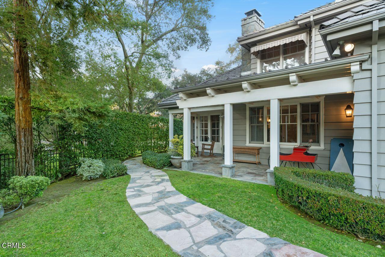 520 Georgian Road La Canada Flintridge, CA 91011 - Photo 50 of 75 a front view of a house with a yard and garden