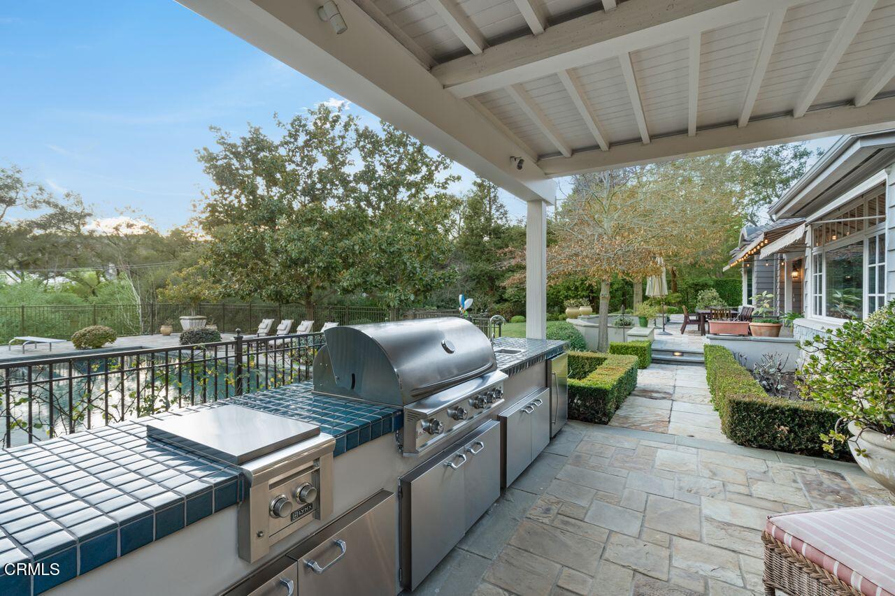 520 Georgian Road La Canada Flintridge, CA 91011 - Photo 53 of 75 a view of a patio with chairs next to a yard