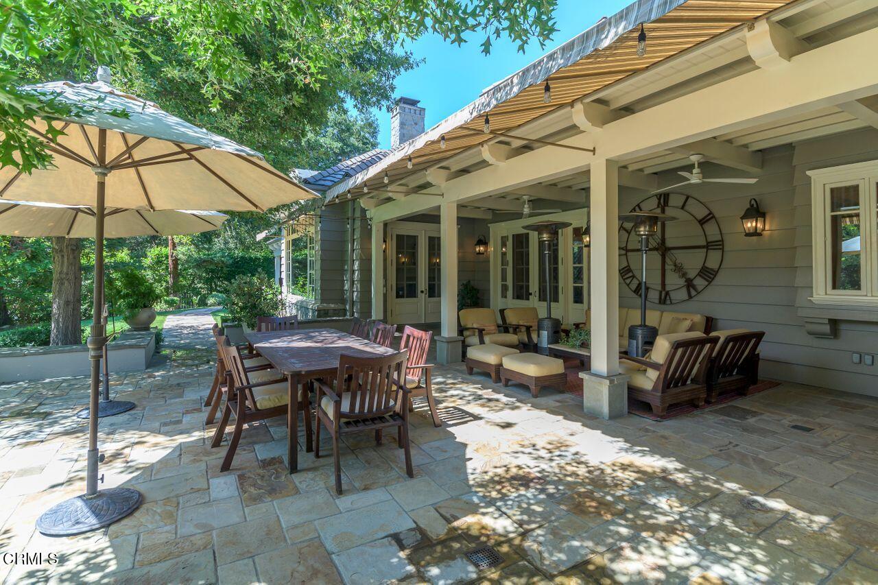 520 Georgian Road La Canada Flintridge, CA 91011 - Photo 57 of 75 a view of a patio with table and chairs under an umbrella