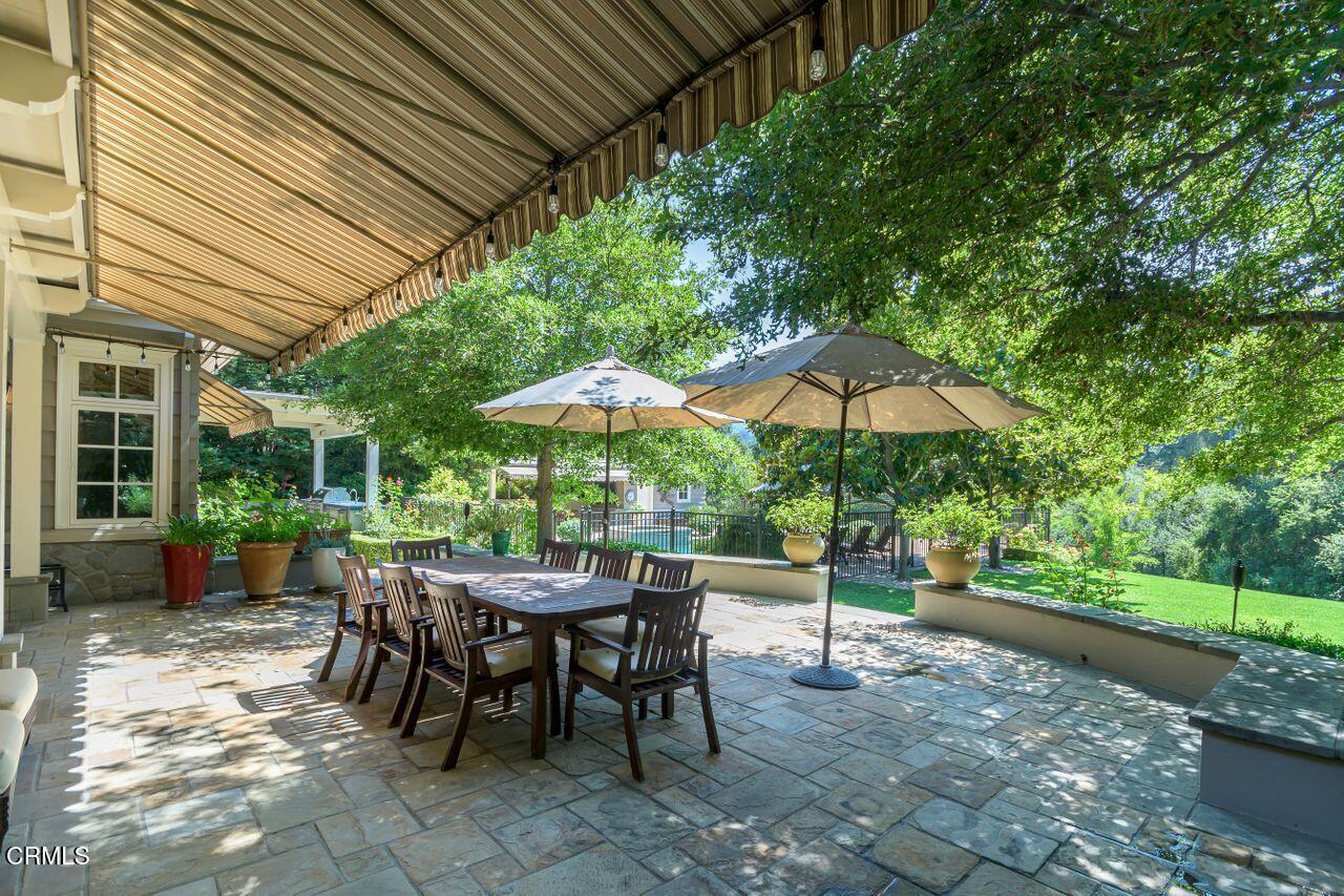 520 Georgian Road La Canada Flintridge, CA 91011 - Photo 58 of 75 a view of a patio with a table and chairs under an umbrella