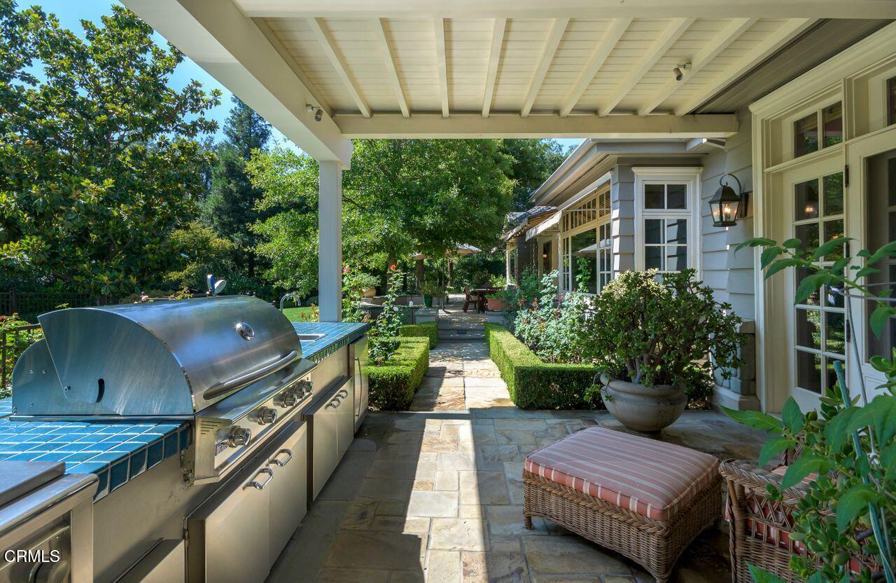 520 Georgian Road La Canada Flintridge, CA 91011 - Photo 61 of 75 a view of a patio with couches table and chairs with potted plants