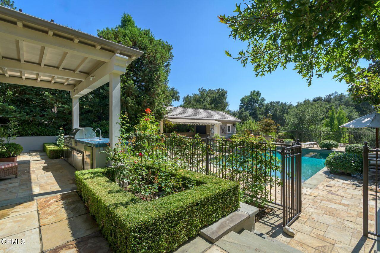 520 Georgian Road La Canada Flintridge, CA 91011 - Photo 63 of 75 a view of a chair and table in backyard of the house