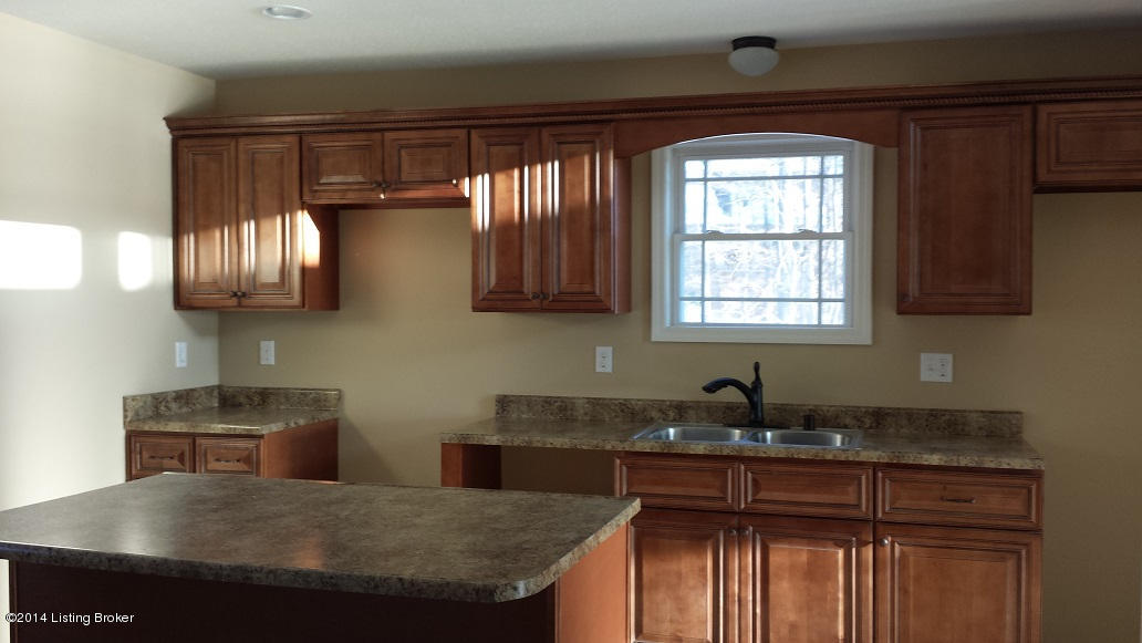 374 Spring Shores Lane Falls Of Rough, KY 40119 - Photo 5 of 14 Kitchen cabinets compliment the wood tones used on the outside of the home.