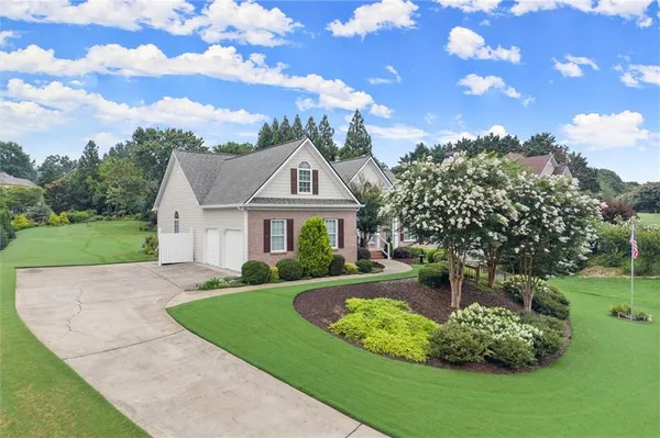 a front view of a house with a yard