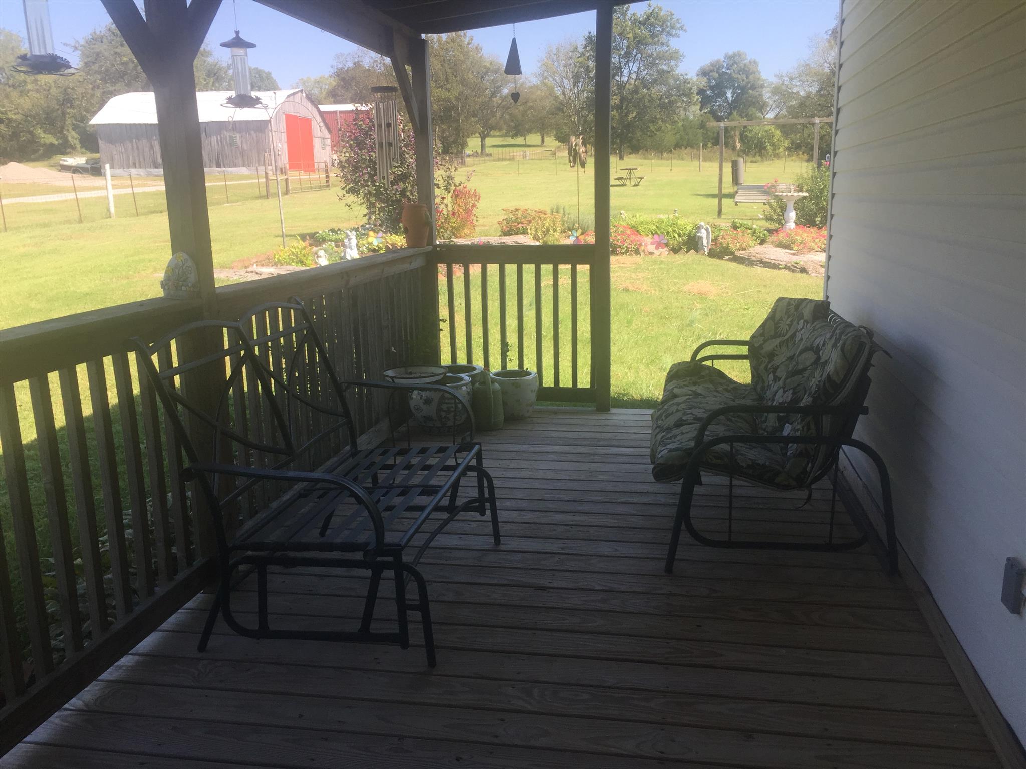 162 Trinity Road Franklin, TN 37067 - Photo 13 of 13 a view of a porch with chairs and wooden floor