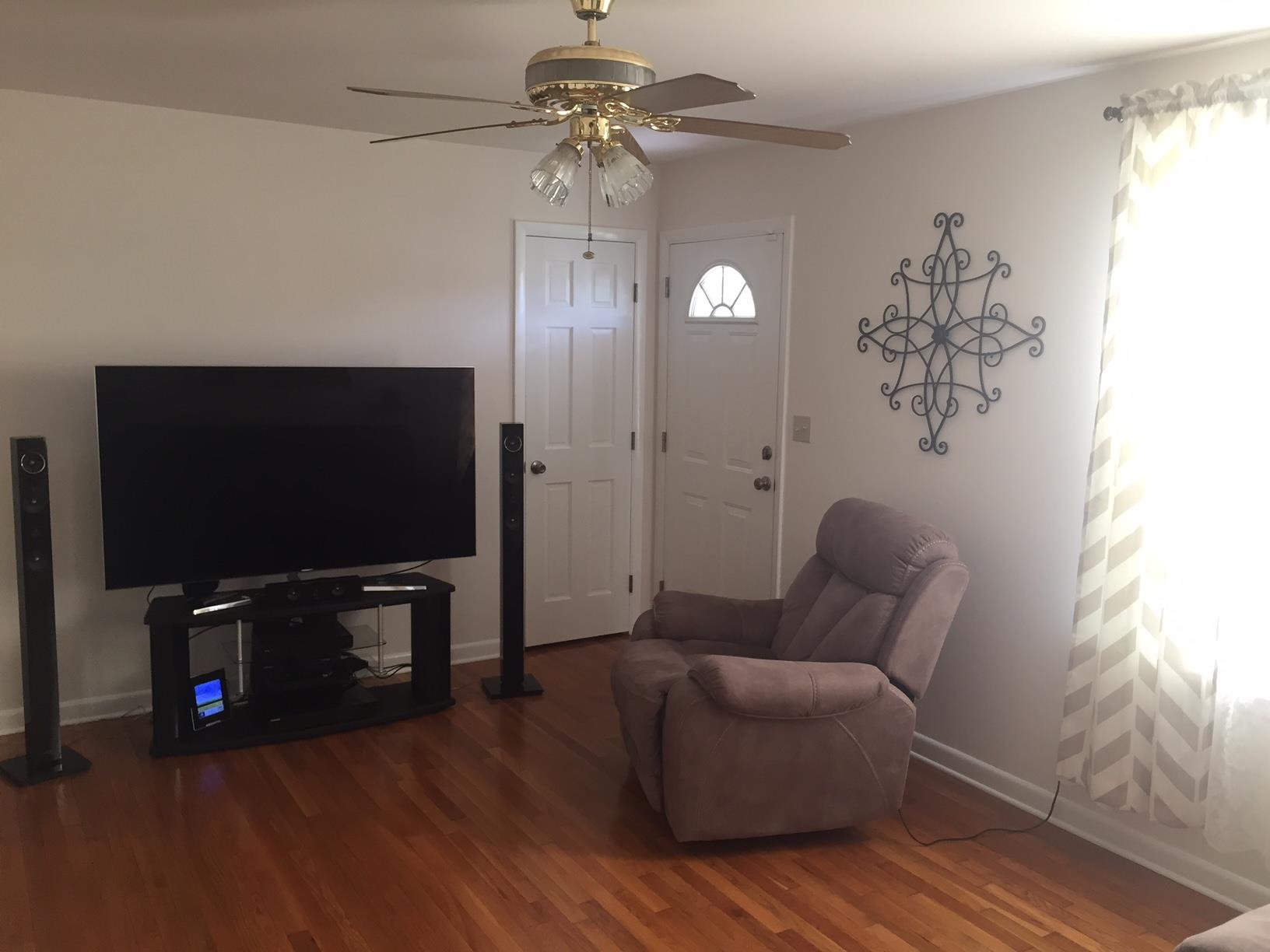 162 Trinity Road Franklin, TN 37067 - Photo 2 of 13 a living room with furniture and a flat screen tv