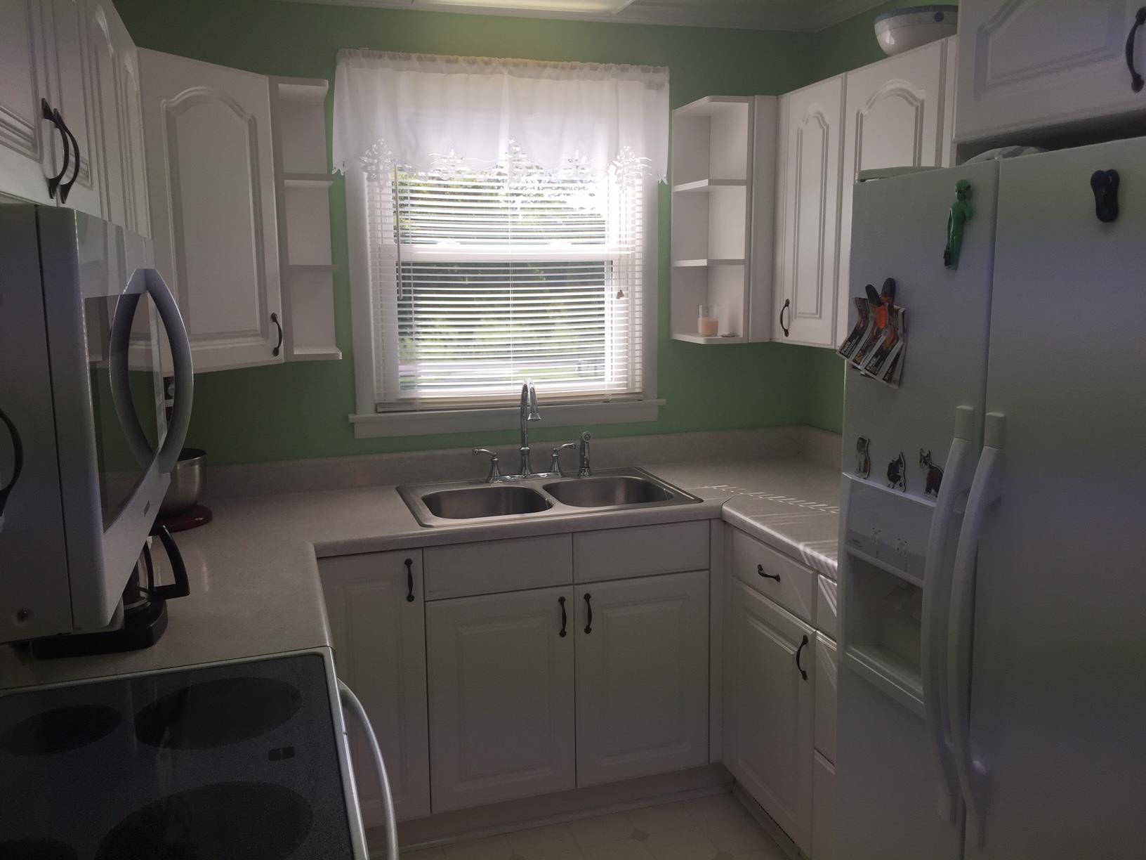 162 Trinity Road Franklin, TN 37067 - Photo 5 of 13 a kitchen with a sink appliances cabinets and a window