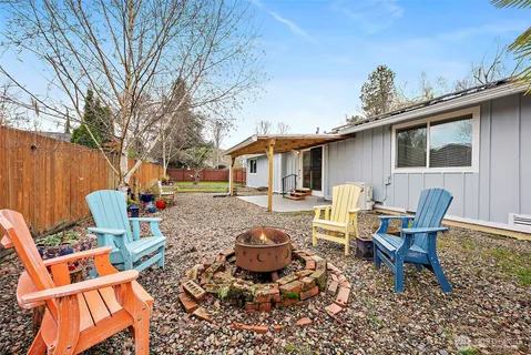 a backyard of a house with seating space