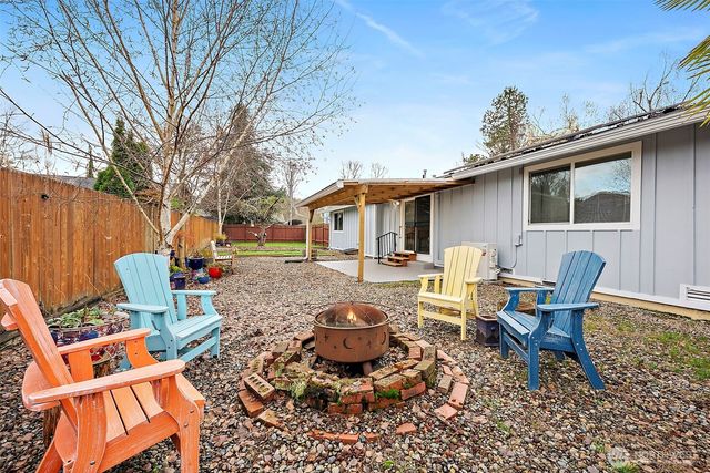 a backyard of a house with seating space