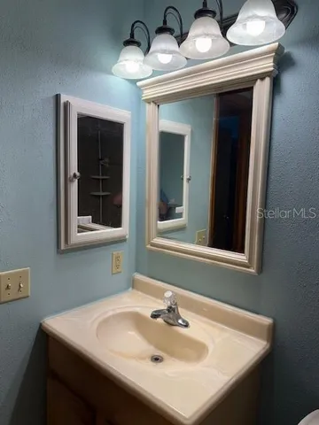 a bathroom with a sink a toilet and a bathtub
