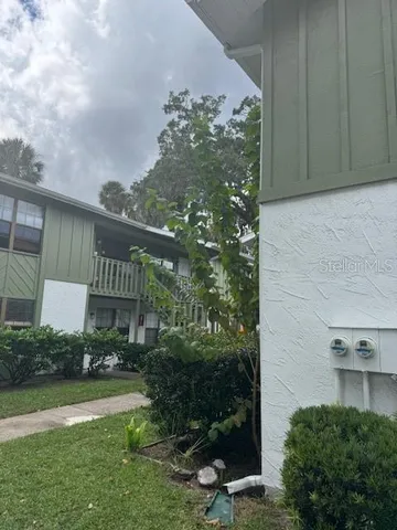 a front view of a house with glass windows and door