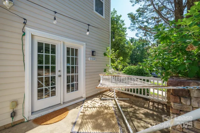 a view of a balcony with wooden floor