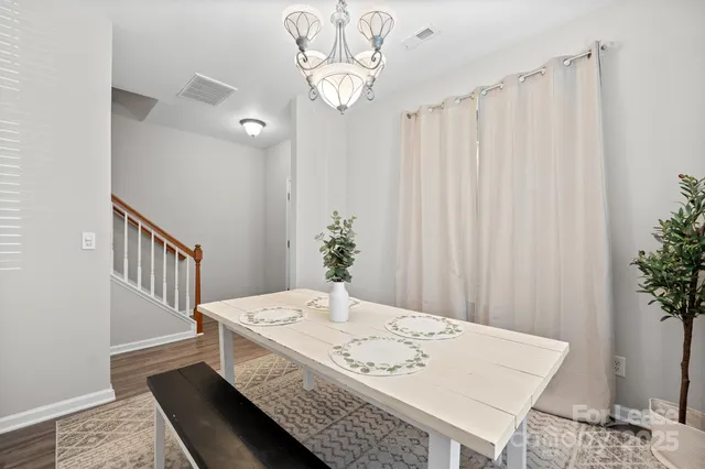 a view of a hallway to a livingroom with furniture